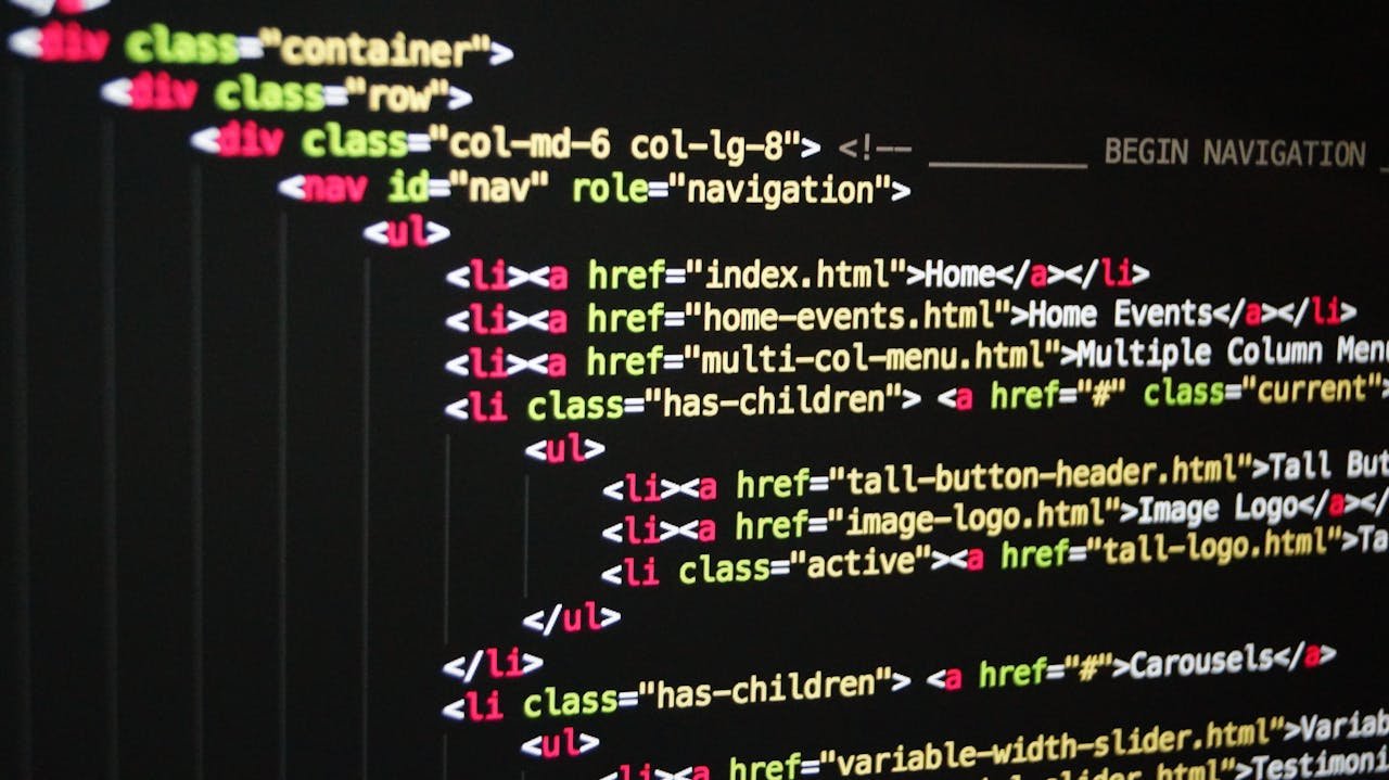 The Art of Drawing Readers In: Your attractive post title goes here Close-up of vibrant HTML code displayed on a computer screen, showcasing web development and programming.